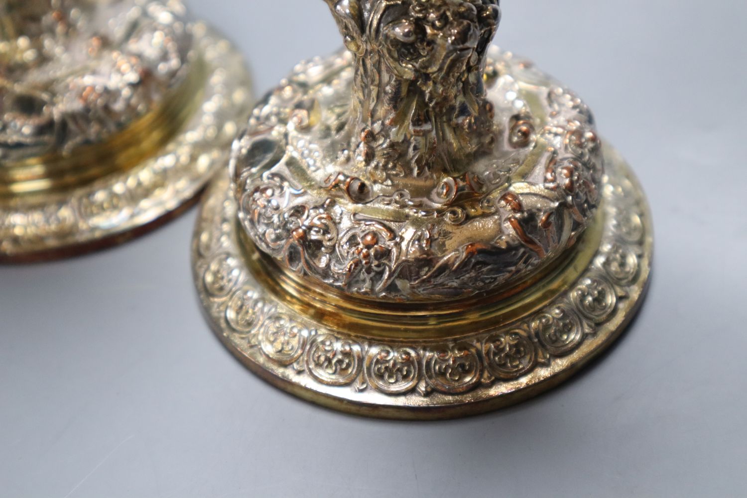 A pair of Elkington electrotype cast plated candlesticks, height 14cm